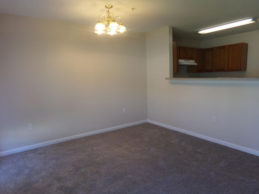 Renovated with new carpet, vinyl flooring, base boards & paint~ This unit is move in ready~ 3 Bedroom, 2 1/2 baths, garage and end unit~ Conveniently located close to schools, hospital and shopping~ The HOA fee includes law service. Master Bedroom has 2 closets~ Laundry closet is upstairs~