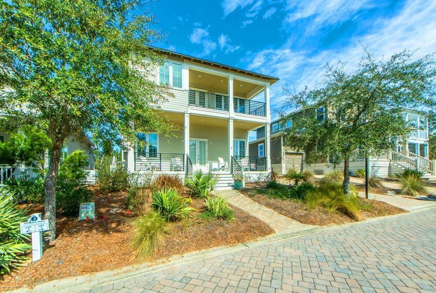 This custom built home boasts a separate carriage house that your family and guests will love! A Spacious and stunning 30A beach home that features both modern amenities and architectural character found nowhere else. From the moment you step into the home you will notice the 12' ceilings, the solid hardwood flooring, custom cabinets, granite counter tops, stainless steel appliances, a Viking gas stove, and plenty   of distinct and natural 30A lighting! The 2nd floor master bedroom features a private balcony and a custom-made steamy walk-in tiled shower. The separate carriage house provides another full bath and kitchenette with a spacious bedroom/office/studio.  You're surrounded by a luxurious waterfall pool, a Hot Tub, Gazebos, Grilling Areas, a 360-observation tower and the beach!