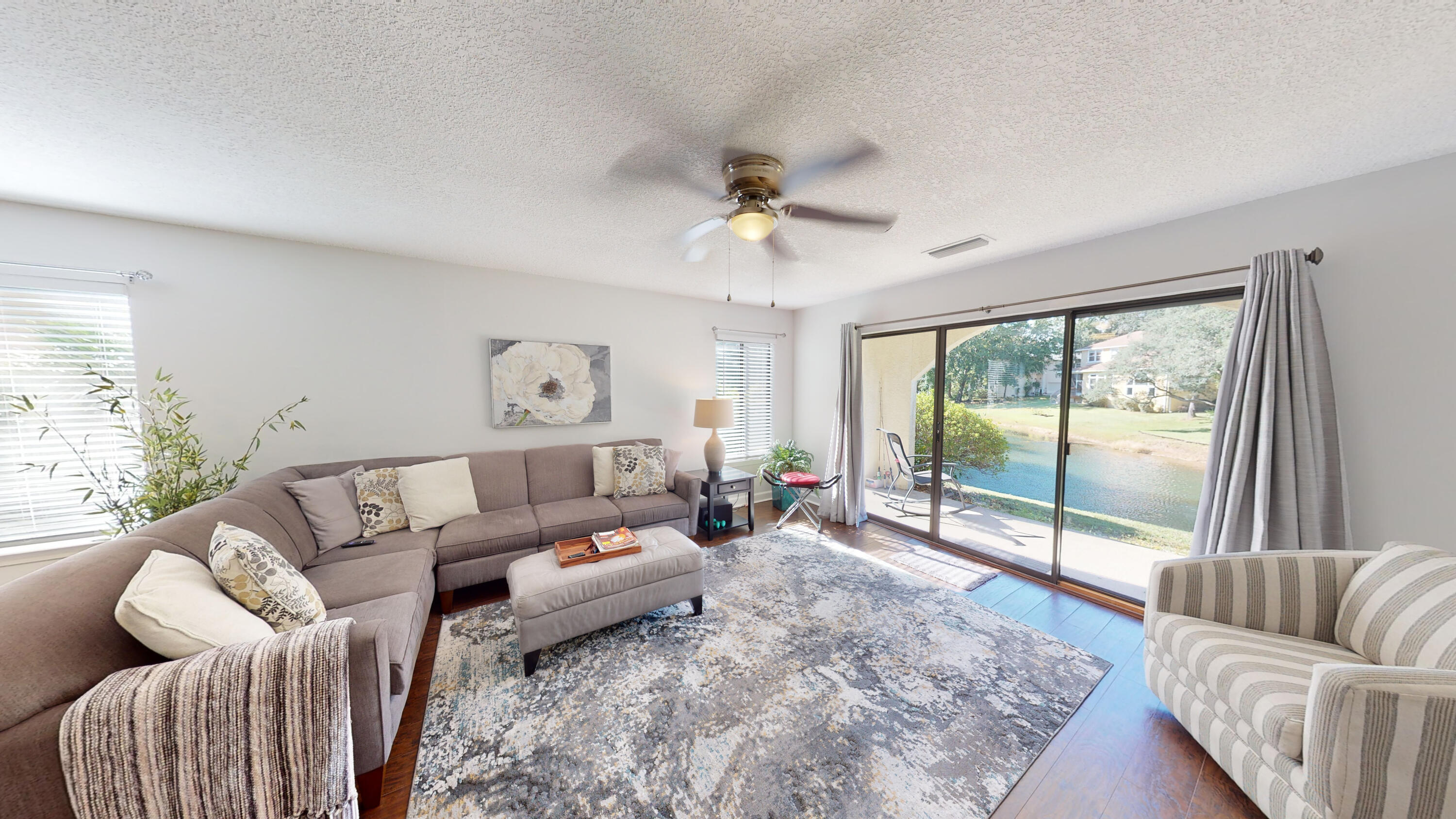 Are you looking for a move in ready FABULOUS condo? Well, this is it! Stunning and comfortable! End unit = more windows and light! 2020 renovated kitchen with new cabinets, silestone counter tops, appliances, and washer and dryer. 2020 carpeting and LVP flooring and tile. Baths also updated in 2020. 2022 master walk in shower. 2020 water heater. 2018 HVAC. The covered patio looks out onto the lake- the perfect place to sip some coffee and watch the visiting birds on the lake. Seller will give $7200 buyer credit with acceptable offer!