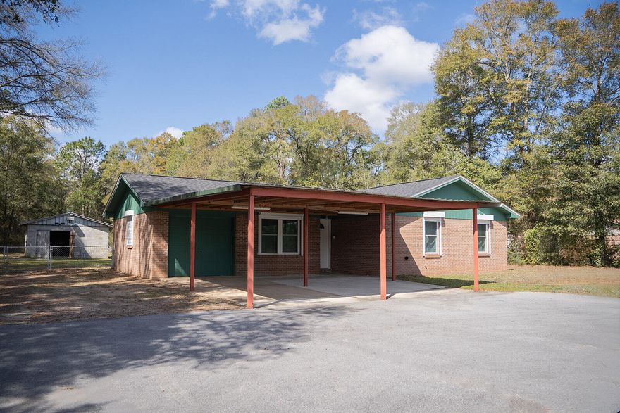 Welcome home to this charming 3-bedroom, 1.5-bath property built in 1990, ideally located with convenient access to both Crestview and Milton for shopping, dining, and everyday needs. Situated on approximately one acre of fenced land, this property offers the perfect balance of space, comfort, and functionality.Step outside and enjoy the screened-in back porch, a great place to relax, unwind, and enjoy the peaceful surroundings. The property provides ample parking, including two covered parking spaces, and the former garage offers exciting potential--it could easily be framed in to create additional living space, a bonus room, or a home office. For those who enjoy hobbies, projects, or need extra workspace, the property includes a cinder block shop with power, offering plenty of room for tools and projects. There is also a separate powered storage shed, giving you even more storage and flexibility.

This home has seen several important updates, including:
" HVAC system replaced in 2013
" Whole-house Generac propane generator installed in 2020
" New windows and storm shutters installed in 2022
" Beautifully updated kitchen in 2023 featuring custom cabinetry and granite countertops
" Both bathrooms upgraded in 2025 with custom cabinets, granite countertops, and a new walk-in shower
" Water heater replaced in 2025

The home also includes a new Samsung washer and dryer (2025) that will convey with the property.

With room to spread out, thoughtful upgrades, and convenient location, this property offers both comfort and versatility--perfect for those looking for a place to call home with space to live, work, and enjoy the outdoors.