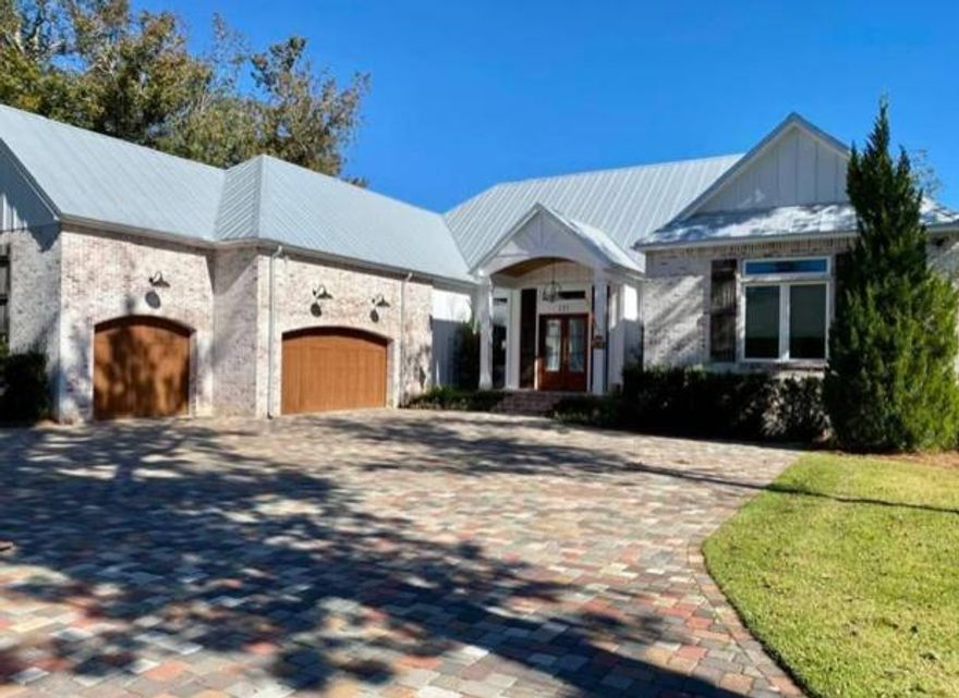 106 feet of waterfront!  Over 1.2 miles of millwork throughout home.  Custom built home that shows like a dream.  Views galore, paver driveway and firepit area, private beach, gourmet kitchen, butlers pantry, brick coved temperature controlled wine room, all bedrooms are large with private bath access.  Reclaimed wood floors, reclaimed brick, high-end stainless steel appliances. extra large laundry room, door walk area, covered patio to enjoy the view (plenty of room to add a pool), sea wall,  so much more - a must to see!!  Buyer to verify all deemed important information.