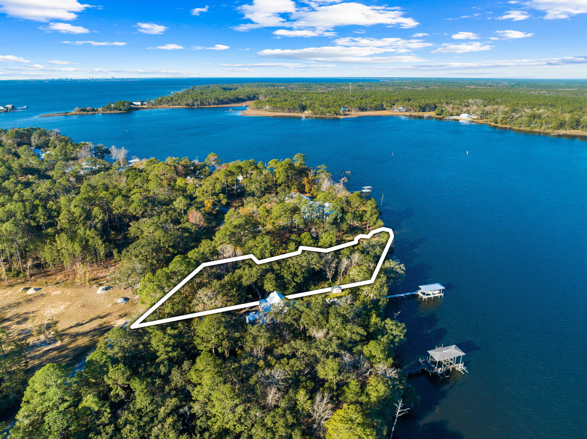 Incredibly unique 1.33 acre waterfront opportunity on LaGrange Bayou, spanning 195 feet in width and 337 feet in depth. With 9,488 square feet of a buildable footprint, this lot offers a canvas for creating your perfect coastal retreat surrounded by Majestic Oaks draped in Spanish Moss. A future build could enjoy scenic sweeping views from almost every room with potential views of the Bayou and lagoon. Potential dock would offer jet skis, kayak, paddle board, and boating capability with close proximity to a marina with fuel dock. With a surplus of waterfront shoreline, the lagoon makes a natural buffer for waterfront quietude, while the bayou's shore creates a beautiful natural beach. LaGrange Bayou is a traditional safe harbor in storms.