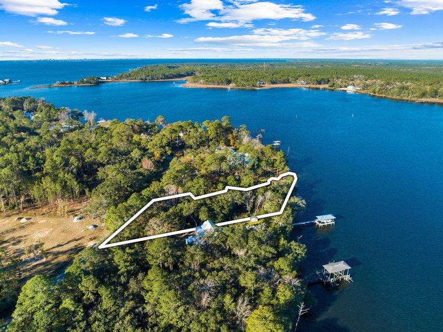 Incredibly unique 1.33 acre waterfront opportunity on LaGrange Bayou, spanning 195 feet in width and 337 feet in depth. With 9,488 square feet of a buildable footprint, this lot offers a canvas for creating your perfect coastal retreat surrounded by Majestic Oaks draped in Spanish Moss. A future build could enjoy scenic sweeping views from almost every room with potential views of the Bayou and lagoon. Potential dock would offer jet skis, kayak, paddle board, and boating capability with close proximity to a marina with fuel dock. With a surplus of waterfront shoreline, the lagoon makes a natural buffer for waterfront quietude, while the bayou's shore creates a beautiful natural beach. LaGrange Bayou is a traditional safe harbor in storms.