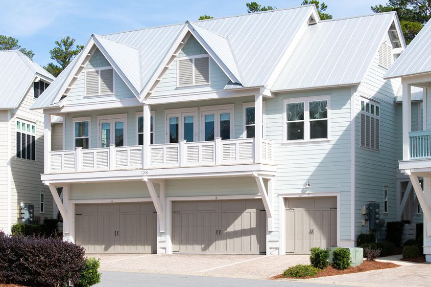 Showcasing a high-end finish and brimming with today's trends, this luxury two-bed townhouse is on the north side of Prominence. Ideal for investors looking for instant income, it's beautifully furnished and move-in ready. Engineered oak flooring and 10-ft. coffered ceilings create a spacious light-filled living space on the second floor above a one-car garage. The sitting room opens onto a private balcony for relaxing in the fresh sea air. Separated from the dining area by a quartz-topped breakfast bar, the gourmet kitchen has built-in stainless appliances, soft-close cabinets, a natural gas range and a deep farm sink. A neat tile backsplash adds a touch of fun to this well-appointed space.