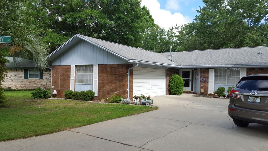 Centrally located brick ranch home located on a cul de sac. Large fenced back yard with mature trees and flowering shrubs. 3 BR , 2 BA, large living-dining room plus a cozy family room with gas fireplace. Kitchen is open to the family room. Home has a 9' x 29' Florida room that is not included in the square feet of the house. Florida room has entrances from the family room and the master bedroom. Split bedroom floor plan. One of the bedrooms has a Murphy bed which conveys. Master bedroom has a walk-in closet. Indoor laundry room. The kitchen stove and the dryer have both gas and electric outlets. Side load 2 car garage for superior curb appeal. HVAC is 6 yrs. old, roof was replaced in 2007, sprinklers and lawn pump new 2 yrs. ago. Backyard storage building conveys.