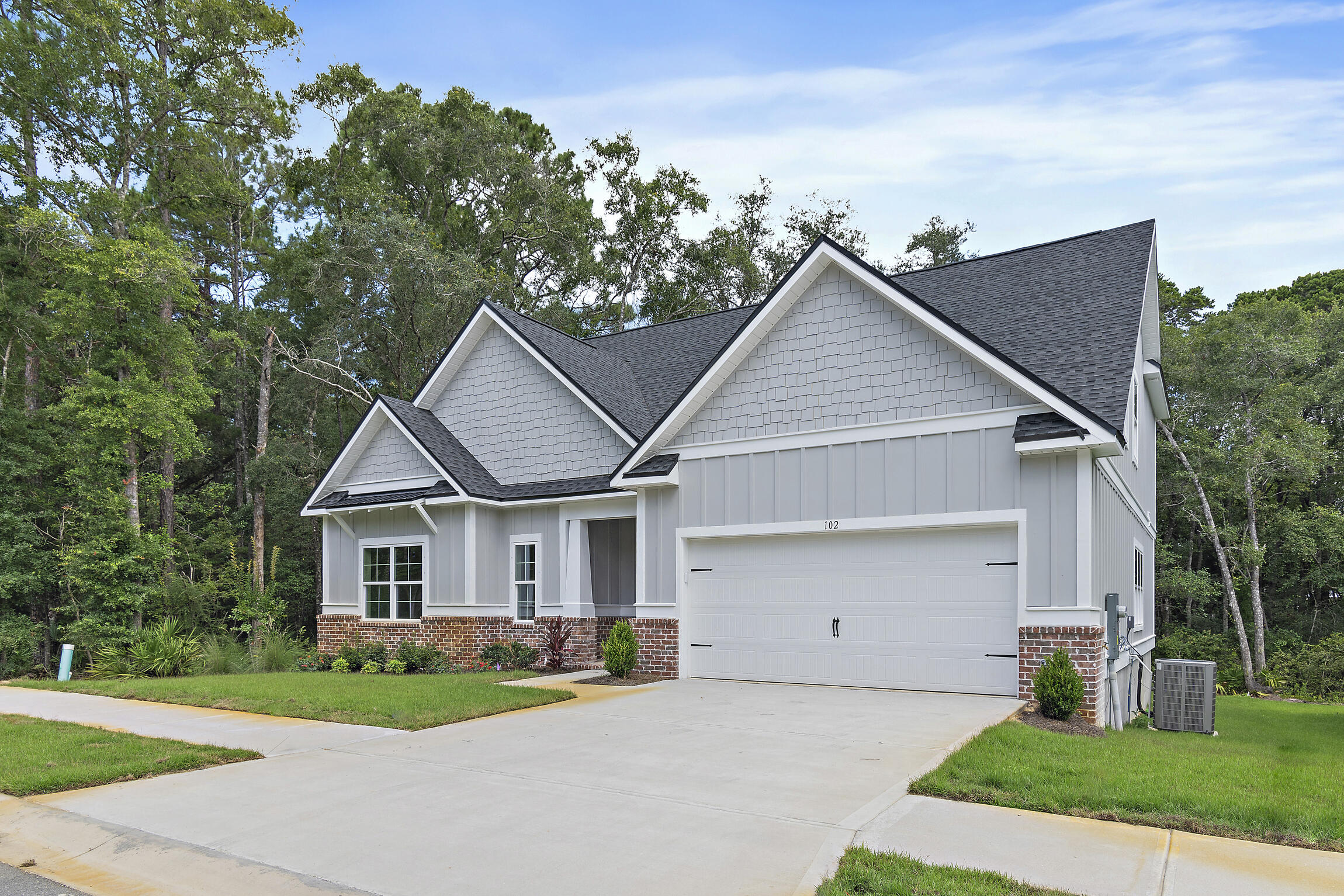 Welcome to your new construction home in the prestigious, gated resort-style community of Bear Creek! This upscale home features vaulted ceilings, LVP & tile flooring, an electric fireplace, and sophisticated white cabinetry with glass stacks to the ceiling and tile backsplash .The chef's kitchen id equipped with a farmhouse sink and pristine white quartz countertops with a stunning waterfall edge. Nestled on a prime lot, this home backs up to a serene green space with a picturesque creek and mature hardwoods. Bear Creek residents enjoy amenities like pickleball, tennis, basketball courts, a fitness center, and a resort-style pool. Phase 3 will add a second pool and four more pickleball courts. Bear Creek is minutes from the Beaches of South Walton, the bay, fishing piers, parks & dining