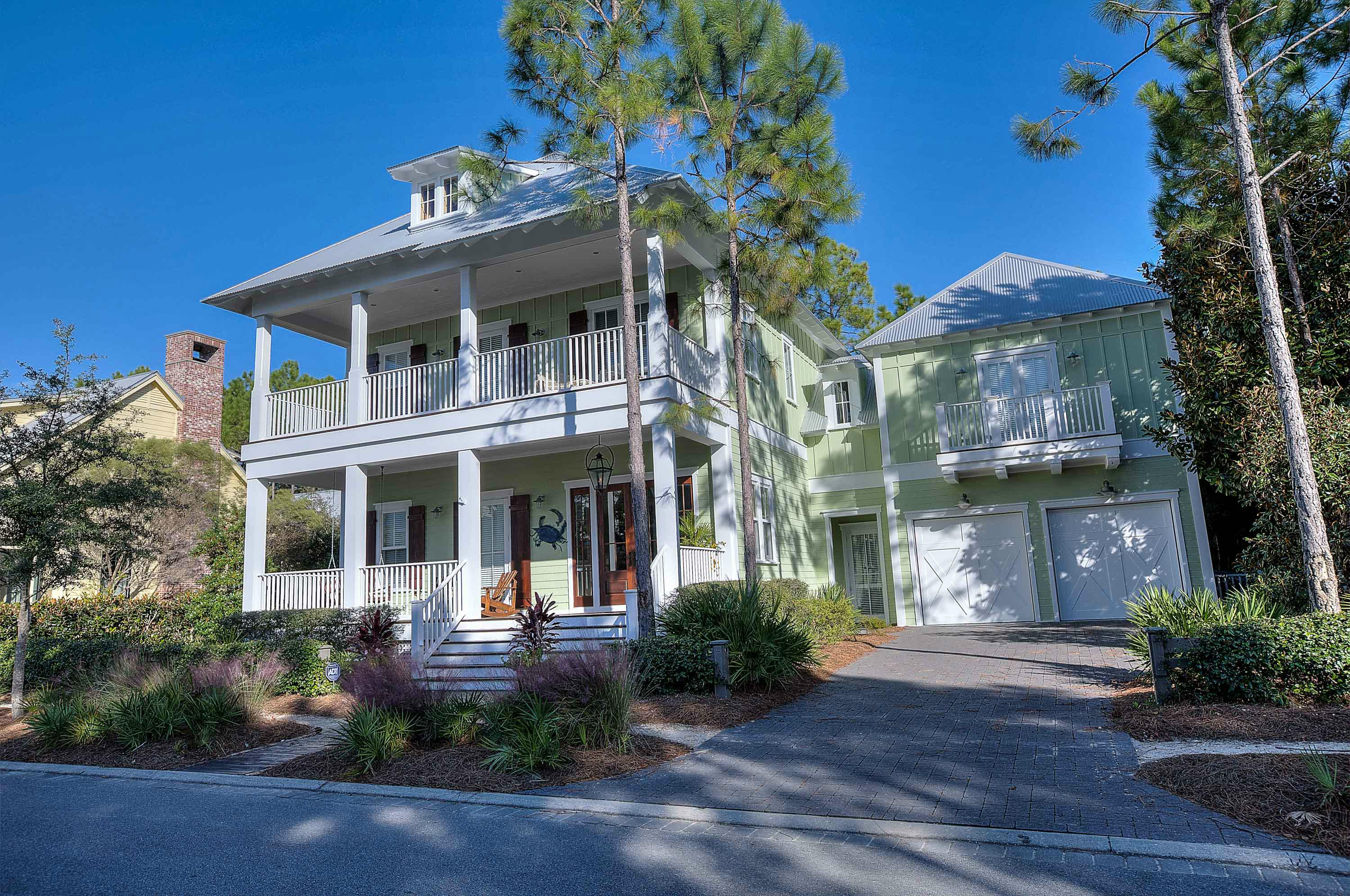This beautiful Watercolor home is a must see. 3905 sq ft home is located on a private lot that is surrounded by two protective spaces that will not be developed and the street has no pass through traffic. Fall in love with the large private fenced-in backyard which showcases an in-ground black bottom pool with integrated Jacuzzi (featuring a waterfall into the main pool), Outdoor Chicago Brick Isokern Fireplace, Outdoor shower and a professional built-in gas grill all surrounded by large beautiful trees. The interior is just as beautiful and welcoming with many spectacular finishes from the grand gas lamp on the front porch to the impact rated mahogany double front door, opening to the grand foyer with antique Chicago brick walls and antique white oak floors throughout the home.