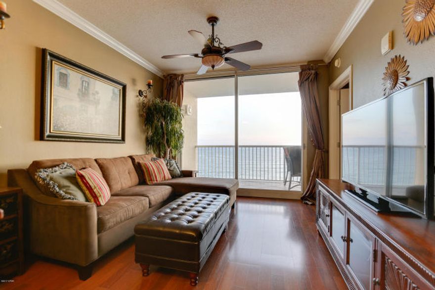 BEST OF THE BEST IN MAJESTIC! PERFECT ELEVATION WITHIN THE STACK!! This one of a kind property conjures up images of sun-splashed days of swimming, biking, and relaxing. It lives like a beach house but comes with all the benefits of owning a condo. This property has been meticulously maintained. Hard surface flooring throughout and conveys with luxurious furnishings, window treatments, and artwork that welcome you to lie back, relax, and enjoy panoramic views of the pool, beach and ocean. Condo has 9' ceilings and crown molding throughout. Open floorplan allows for fabulous Gulf and sunset views from balcony, living room, dining room, kitchen, & master suite providing the ultimate alfresco living and entertaining environment!.