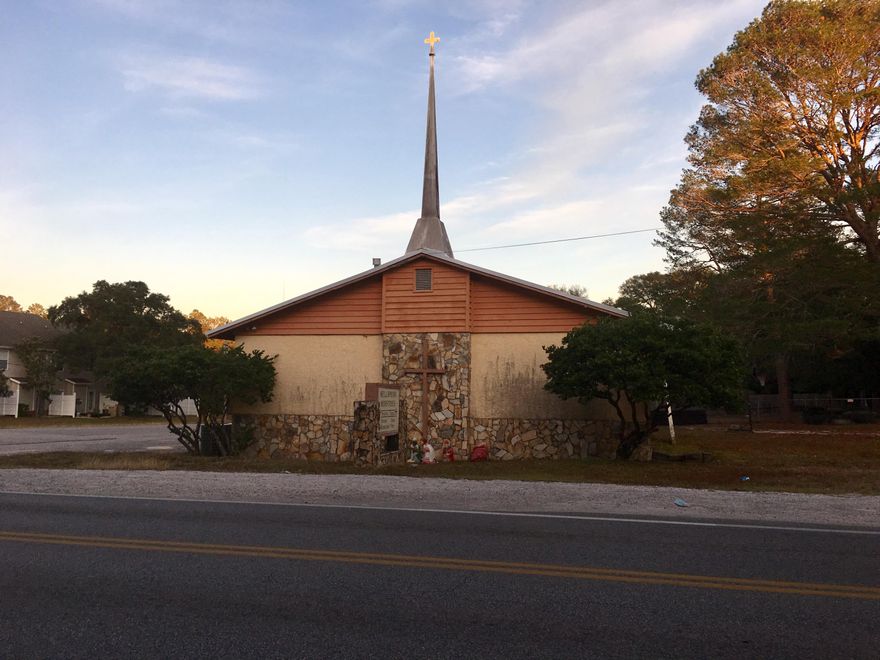 This church is ready for immediate use. The pews are in place and there are a new roof and HVAC within the last 2 years. Next door is set up for a school with kitchen and common area as well as small classrooms.