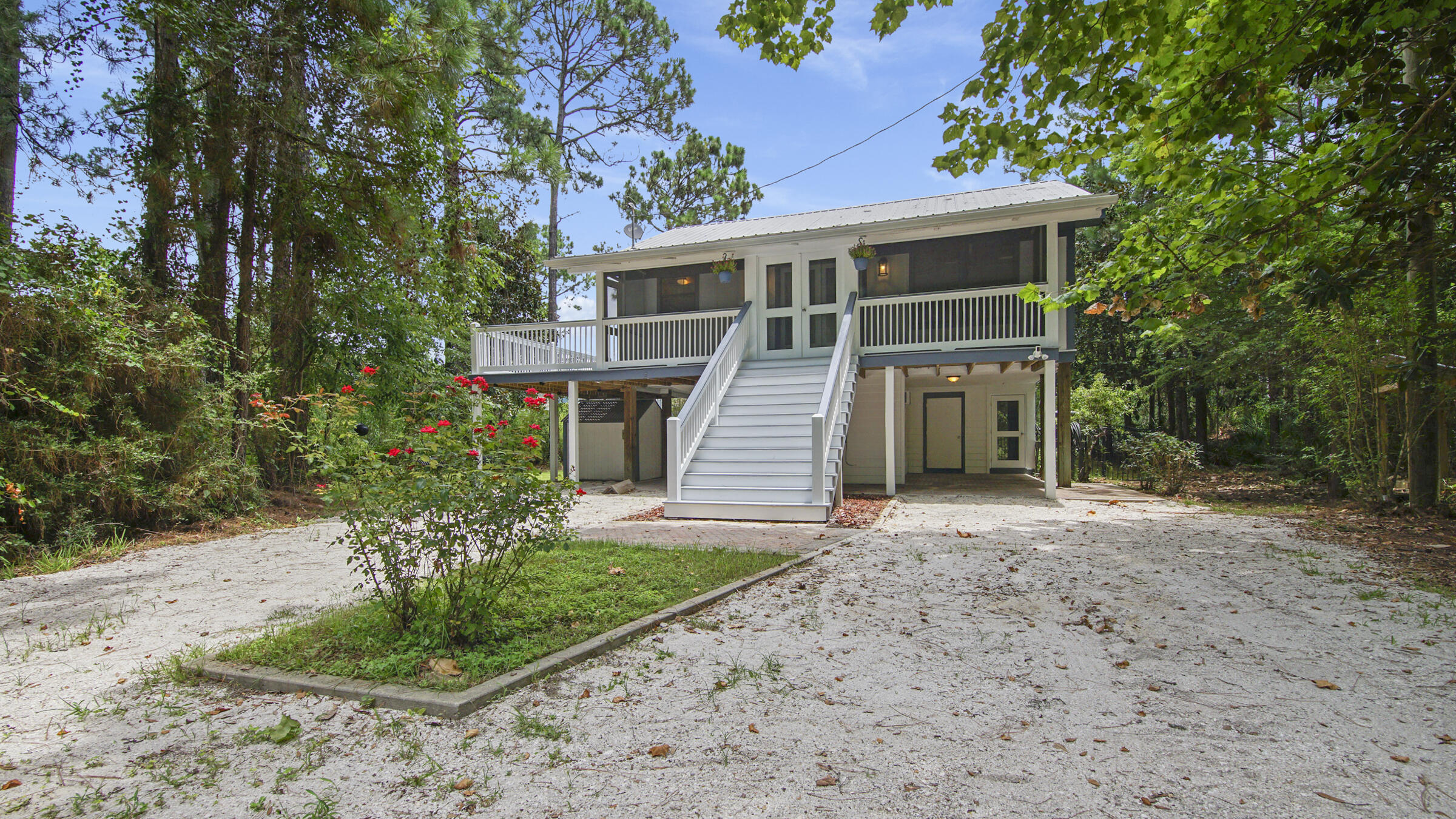 The Treehouse is a lovely 2 bedroom 2 bathroom Florida cottage stilted above an air conditioned studio, and an enclosed workshop perfect for a variety of artistic activities. Nestled in a wooded oasis, listen to the birds and watch the wildlife from your screened porches. Do you feel like going to the beach or being social on 30-A? Go ahead, your new home is only minutes from all the wonderful things that South Walton has to offer! This lot also has plenty of parking for and is designed to back a hitched boat and truck directly under the home after a day on the water. Only 1/2mile to the Cessna Landing Boat Ramp and four miles from the beach.Hot water heater was installed 2023, new LVP flooring (lifetime warranty) and roof was replaced in 2018.