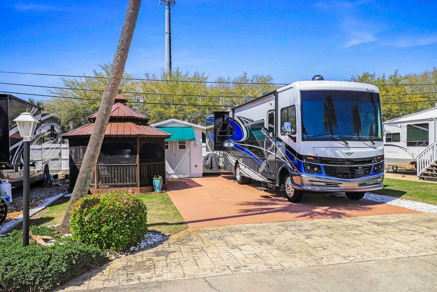 Don't pay the high gas prices to travel, own this lot 3 blks from the white sandy beaches of South Walton. Enjoy this Gated 'Class A' Coach Non-Rental Gated Community of 15 lots w Palm trees, irrigated Landscape, Pool & Pool House with Laundry and Restrooms. Lot has screened Gazebo newly renovated with new tin roof and outdoor kitchen complete with ice maker, ref, sink and TV.  Climatized Coach House (Exterior Master Closet) complete with built ins. Enjoy maintenance free living in a friendly Beach Community.  RV being sold separately.