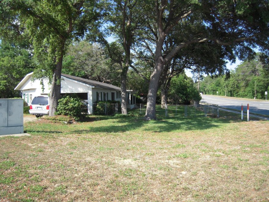 This property is also listed under a residential listing #812710. High visibility location on the intersection of 2 busy streets. Two other corners of this intersection are occupied by convenience fuel stations and the third by Ruckel Middle School.The building currently houses a 3 chair beauty shop and a 3 bedroom, 2 bath home for living or that can be converted to business use.