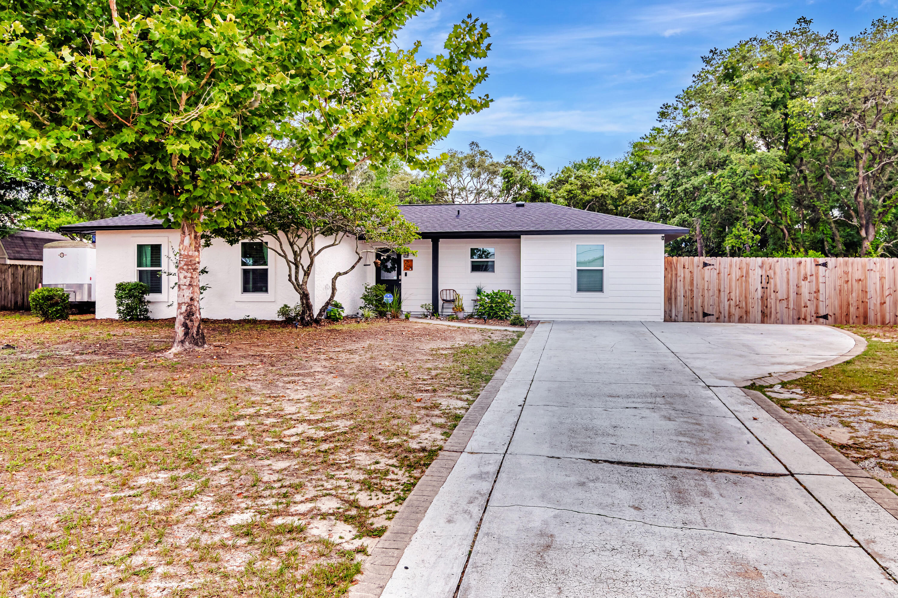 This beautifully renovated home offers the perfect blend of comfort, convenience, and style--just a short drive from both Eglin and Hurlburt Air Force Bases and minutes to the beach. Enjoy peace of mind with major updates already completed: a brand-new roof in 2023, all new windows in 2024, plus an HVAC system and water heater both installed in 2020. Step inside to an open-concept floor plan where the modern kitchen seamlessly flows into the spacious living and dining areas--perfect for entertaining or relaxing with family. The oversized master suite is a true retreat, featuring a large walk-in closet and a luxurious master bath.Out back, enjoy your private deck equipped with shaded pull-downs and a projector screen--ideal for cozy movie nights.