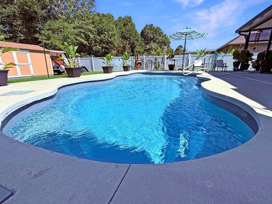 Life is good! Featuring a desirable split floor plan, 9ft high ceilings, recessed lighting and granite countertops throughout the home! Splash the summer around in your New Pool! 30 x 16 heated and cooled pool installed 2023! Double granite vanity in master bath with roomy tiled shower shares a half-glass wall with the separate tiled tub. Enjoy MB with large walk-in closets. Grand 20'x20' Florida Room overlooking a large fenced backyard! Quality handmade maple cabinets adorn the kitchen, complemented with recessed lighting overhead and under-mount lighting over the granite countertops. The master suite features large walk-in closets. One bedroom and bathroom are located on their hallway, for more privacy. High 9' interior walls raise the interior ceilings for a grand sense of space