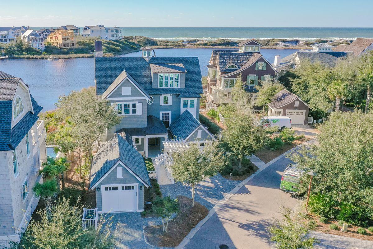 Set in the gated WaterSound Peninsula community, enjoy extraordinary views of Camp Creek Lake, the Gulf of Mexico and pristine dunes from this lake-front masterpiece with 67 feet of lakefront footage.  Built in 2016, the home was custom designed by TS Adams and built by Gulfview Construction with attention to every detail. Approaching the home through a picturesque courtyard with Dominican shell walkways, guests are greeted by a relaxing water feature, green arbor and a spacious covered porch. Upon entering the welcoming foyer, the first level contains a sitting area, 2 guest suites, and a well-appointed owner's suite. The pool and hot tub await just off the back porch. 4 porches encompass 1000 s.f. of viewing pleasure!