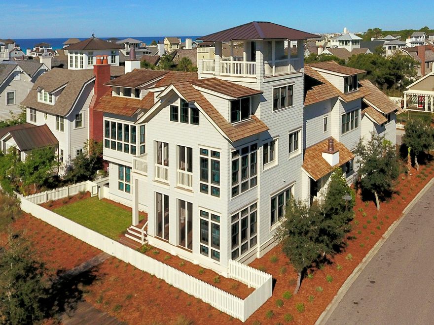 Placed on one of the largest lots in the premiere 256 acre gated community of Watersound this beautiful home provides the ultimate in a sophisticated coastal lifestyle.The architect has created the perfect combination of multiple retreats and gathering spots which provides the perfect intimate environment for two or twenty.Indoor and outdoor spaces invite you to come relax and be at home.The home has a two car garage and a separate golf cart shed. You enter this amazing compound through an inviting water feature which draws you in to a spectacular outdoor living space with your private pool. The pool can be opened to an interior living space and porch with a fireplace. Private guest suites, gulf views from multiple locations...this home is amazing and unique. Put it on your must see list With a total square footage of 5820 the home is arranged to create comfortable and flexible living space.  The first floor invites you in with a large pool and deck along with a large grilling area, sink and refrigerator.  A trio of copper wall scuppers provides the  sound of gently splashing water. There is an easy access powder room for use from the pool deck, and a wall of bifolding doors to open the outside area into the interior pool den. Off the opposite side of the pool den is a screened fireplace porch providing an additional seating area. Downstairs you will also find a guest suite and bath along with a bunkroom and bath. A large luandry room provides great space and additional storage on this floor.  A unique feature of this home is a large guest quarters assesible from outside the home.  This allows for guests to stay without having to access the main house. 
The second floor was arranged to capture the gulf views to the south. With 3 seating areas you can have small intimate groups or a large crowd!
Two dining areas one of which provides gulf views for morning coffee or intimate dining attaches to a screened porch leading to an open porch.
On the second floor is an apartment with living area, full kitchen and dining area along with a separate bedroom and bath. Perfect for long term guests or family members. There is also another guest suite on this floor. 
The third floor houses the very private master suite tucked in to provide morning views of the gulf as you awake. Cozy and comfortable with access to an open porch with a fireplace it is your perfect retreat. On the third floor you also find your access to the open tower with its amazing vistas of the dunes, the gulf, and Watersound rooftops. What a special place indeed!
WaterSound amenities include neighborhood pools, clubhouse, fitness center, foot paths, dune walk overs to the beach and a post office.  As an owner, additional amenities are available through the purchase of one of three St. Joe Club & Resort memberships.  Click on documents for add'l info.  Buyers fee of.5% of purchase price payable to St. Joe Community Fnd and .5% of purchase price payable to Watersound HOA at closing.

