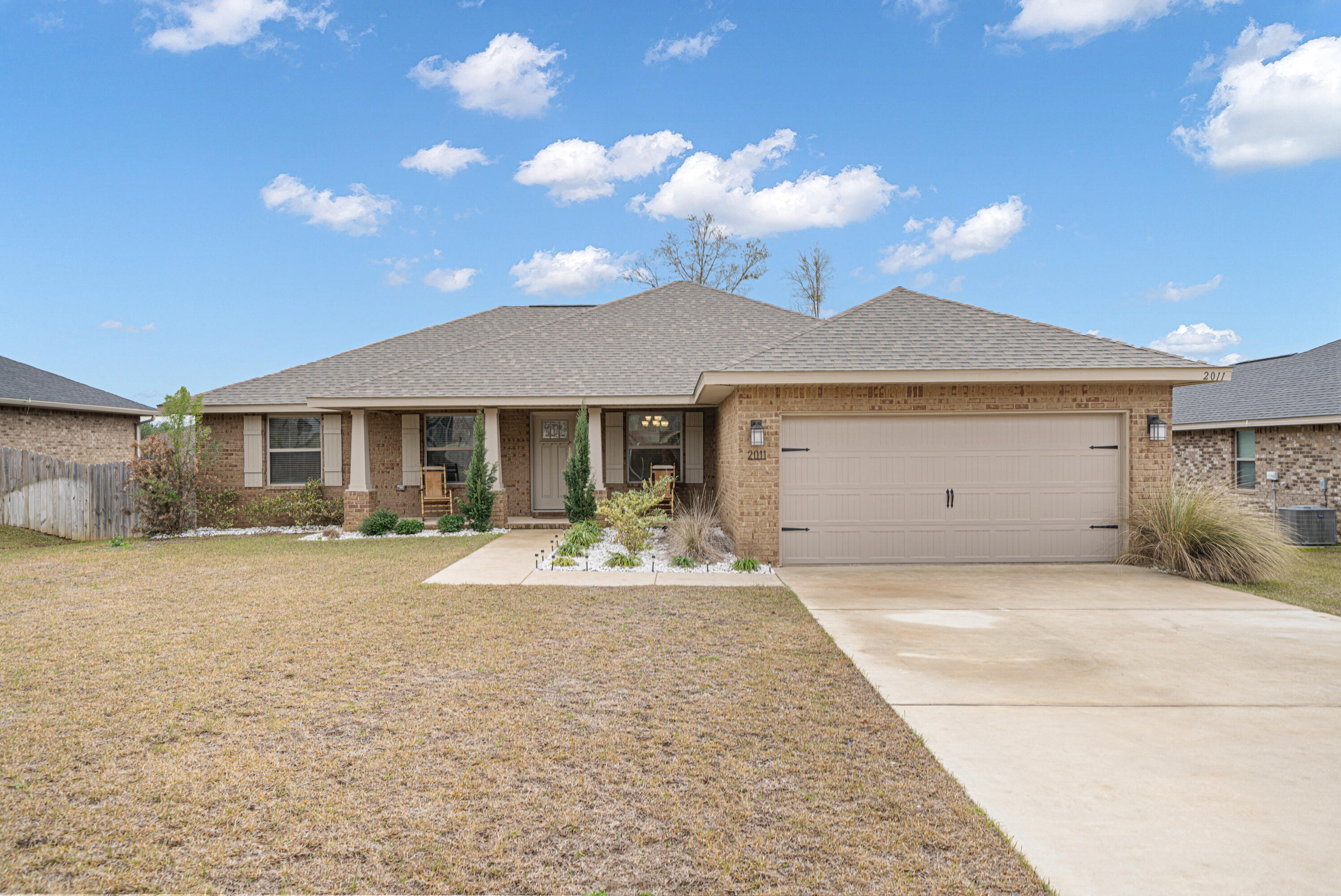 Welcome to this beautiful, like-new home built in 2022 by the highly reputable Adams Homes. This all-brick, 2-bedroom, 2-bathroom home offers quality craftsmanship and modern upgrades throughout.At just 2.5 years old, all the major components--including the roof, HVAC, and water heater--are still like new. The spacious living room features a cathedral ceiling, creating an open and airy feel. The kitchen boasts granite countertops, while the main living areas have durable LVP flooring, with carpet in the bedrooms for added comfort. The garage floor has been epoxy-coated for a sleek, durable finish. Energy-efficient solar panels add extra value, helping to reduce utility costs. The fully fenced backyard offers complete privacy, and the wood deck provides the perfect spot for relaxing
