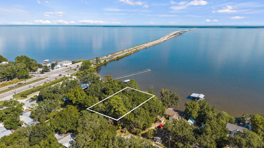 Currently Under Contract - Seller is Accepting Back Up Offers. Discover an extraordinary WATERFRONT opportunity to build your dream home along the pristine waters of the Choctawhatchee Bay. Offering 77 feet of direct Bay frontage and spanning .33 acres, this homesite captures the essence of coastal living. 81 Bay Magnolia Lane in Santa Rosa Beach, Florida is where sunrises shimmer across the water and evenings bring tranquil breezes and pure views off the Bay.It's a dream to live with your boat in your backyard and on this waterfront property, you can! Put the boat down in the morning and head to Crab Island for the day where you'll enjoy all that the coastal life offers on the Bay. Perfectly positioned just 10 minutes from the sugar-white sands and turquoise waters of Highway 30A, this location offers the best of both worlds with easy, quick access to charming coastal towns like Rosemary Beach, Alys Beach, WaterSound and Grayton Beach. 

This peaceful, bayfront homesite offers easy access to world-class beaches, dining, and entertainment in a highly desirable location with NO HOA. Enjoy a short stroll to local favorites like The Bay Restaurant and North Beach Social, where sunsets, family-friendly dining and live music set the tone for laid-back coastal living.
This property is in Zone X and surrounded by beautifully designed neighboring homes with mature trees and stunning Bay views. 

This presents an exceptional canvas for your custom waterfront retreat where you can remove the existing block home and garage carriage house and built your home or renovate the existing home and enjoy the Florida cottage style that rarely exists. With sweeping views, walkability, and proximity to the heart of South Walton, this is more than a homesite. It's truly a lifestyle.

Buyer to verify all measurements. Existing structures on property will be sold AS-IS.