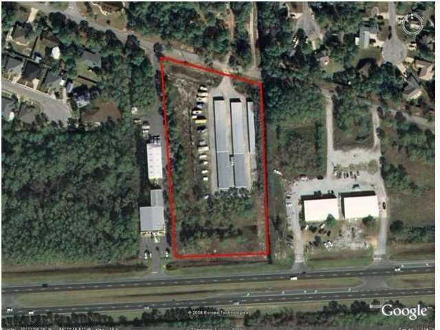 4+ acres including 18,300 SF of mini-storage has frontage on Hwy 98 and on Forest Shore Dr. High visibility as existing business, or development parcel with income to help with carrying costs during permitting stage. New traffic signal, at Forest Shore Dr & Hwy 98, creates easy access to Hwy 98, for east and west travel. All information and dimensions to be verified by buyer.