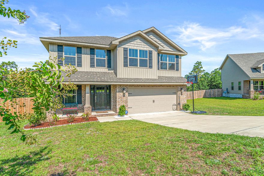 Gorgeous Craftsman style 2 story home with a fully sodded fenced yard gives this home tons of curb appeal. ALL upscale furniture and appliances are negotiable. Huge back yard backs up to a nature preserve for privacy. This 4 bedroom and 3 bath home has the perfect space for a home office or guest room on the first floor. The second floor offers a grand master bedroom, 2 bedrooms as well the laundry room and a large loft area. The master bath has a garden tub, separate shower and a large walk in master closet. Home has top of the line security system with cameras included.