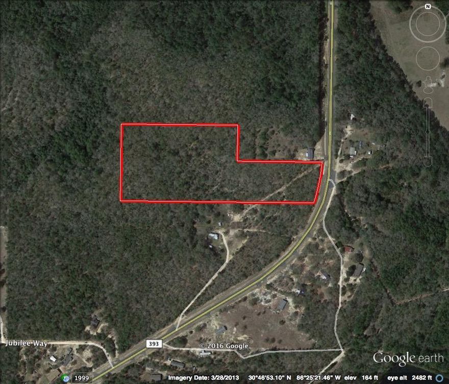 10.07 Acres paved county Highway 393! Big trees lots of paved road frontage. Auburn Water system, Power available.