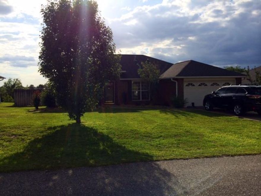 Lovely 3 bedroom, 2 Bath home with additional office space/den. Split bedroom plan, large Living Room, Eat In Kitchen with island and granite counter tops (2014), newer cabinets, newer flooring throughout, new AC 2014, newer all fans and lighting fixtures. Home has wood and tile throughout, tiled shower. Back deck with privacy fence that backs up to woods.Gorgeous home !!