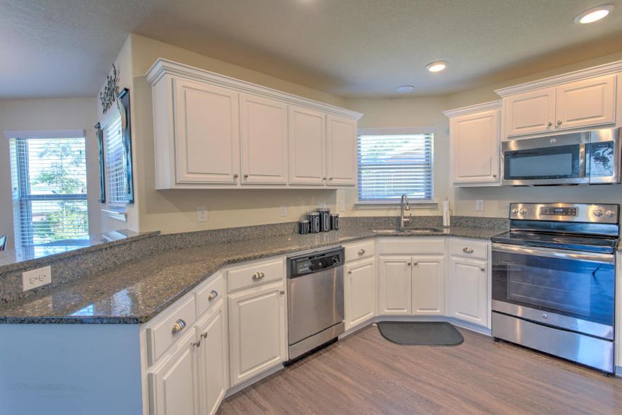 This almost brand new, spacious home has such a gorgeous kitchen featuring white & grey colors with granite counters, custom cabinets plus crown molding. Upgraded flooring throughout, cosy bonus/study OR second living room upstairs giving an extremely spacious feel to it. Master Bedroom has a box ceiling, separate walk in closets and split Jack & Jill vanities well as a fixed window for natural light. Wonderful, back yard with a lot of privacy & space. Close to everything & all together just a beautiful home full of character and many other upgrades. Call quick you know it's not going to last long!