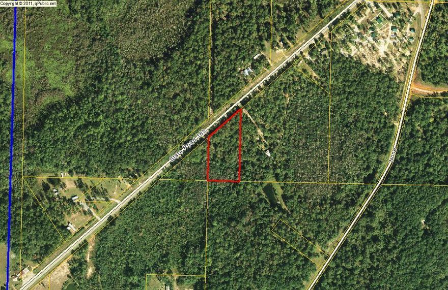 SELLER SAYS MAKE ME AN OFFER Wooded home site. Located just across the Walton County line in Holmes County. 300 feet of paved road frontage. Great home site. Better price make offer.