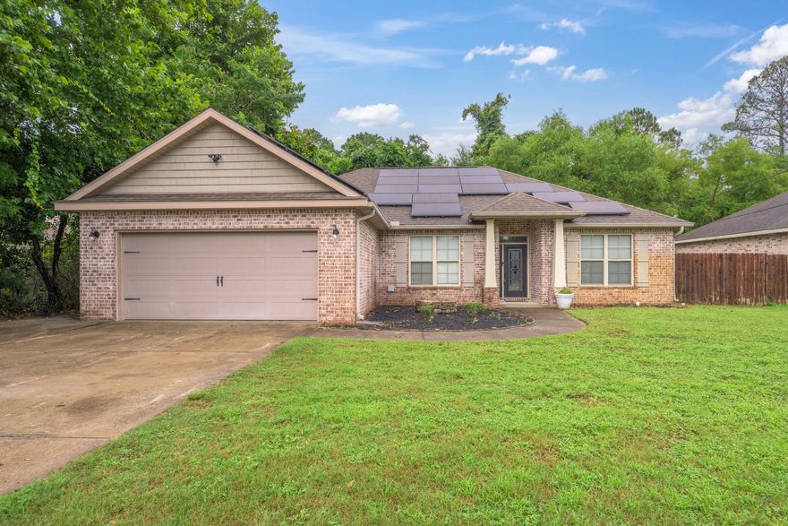 In your home-buying ERA? Check out this fantastic 4 bedroom, 2 bath brick home with an open floor plan and an easy commute to military installations (about 5 miles to Eglin Air Force Base; approx 9 miles to Duke Field/7th group) schools, shopping, restaurants, and medical facilities.  Going green is not a beige flag!!! Adulting is easier with solar panels: these panels will be paid for by seller at closing and seller says his monthly average electric bill is less than $100 due to offset from solar panels--Good for the environment, even better for your wallet so you can spend your hard-earned cash on other things.  The solar panels add up to significant savings every month with an expected estimated 20 years or more of full output. Double pane windows, brick, newer home = energy efficient! From the beautiful front door and foyer you can see the high ceilings with decorative tray details. No CARPET: Luxury vinyl plank and tile floors throughout; gorgeous granite counter tops, stainless appliances, and big windows are among the many outstanding features of this home.  Split bedroom floor plan with an open kitchen/dining and living space make the home live large. The master bathroom offers a large tub and a separate shower, and a massive closet. The front bedroom is set up as an office with a keypad entry. Huge windows let in lots of natural light. Enjoy the Florida lifestyle on your screened back porch overlooking the privacy fenced yard. Mature trees nearby add shade and birds/wildlife abound! Park your boat/jet skis on the extra parking pad on the side of the house.  A great location only 13 miles to the sugar-white sandy beaches of Okaloosa Island!   

 