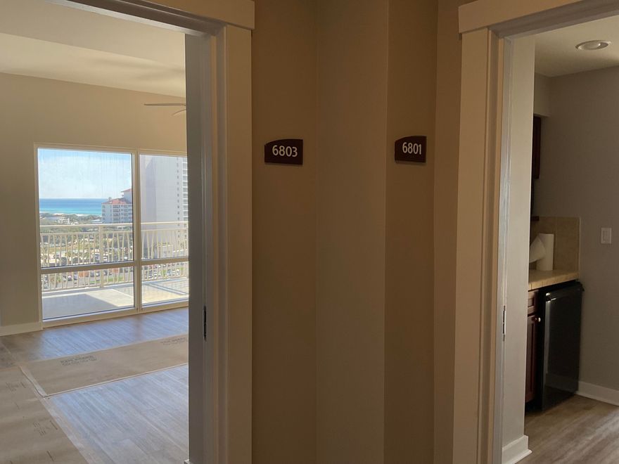 Views Views Views!!! 8TH Floor, SE. Corner - Unfurnished unit has absolutely incredible Views of the Gulf and the ever-popular Luau pool! In fact, the views from EVERY room are beautiful. On a clear day, you can see all the way to PCB from the wrap-around balcony.  6801-03 has new paint, new floors, ship-lap breakfast bar, and more, ready for you to personalize and decorate.  Luau has a parking deck for each building (no assigned parking spaces) and each unit has a dedicated storage 'cage' located in a secure area near the ice machine. Enjoy your mornings at the beach and your afternoons at the lagoon style pool.  There's a Tiki Hut by the pool, where you can purchase your favorite beverage as you relax and enjoy the sunshine.