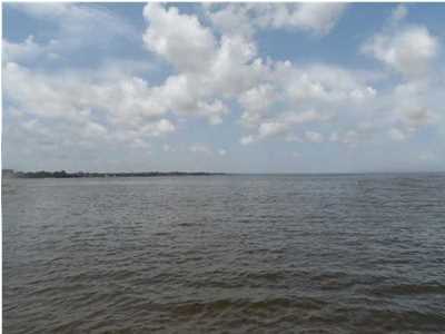 Beautiful waterfront lot on East Bay! Southern exposure with spectacular views! Build your dream home or vacation cottage. Perfect getaway location on quiet street. Enjoy the serenity and incredible sunsets! Environmental Study has been done. Wetlands are limited to a small area immediately adjacent to the shoreline. Copy of the study is available for review. Survey is also available. There is public water and sewer lines have been installed. This piece of paradise is waiting for you!