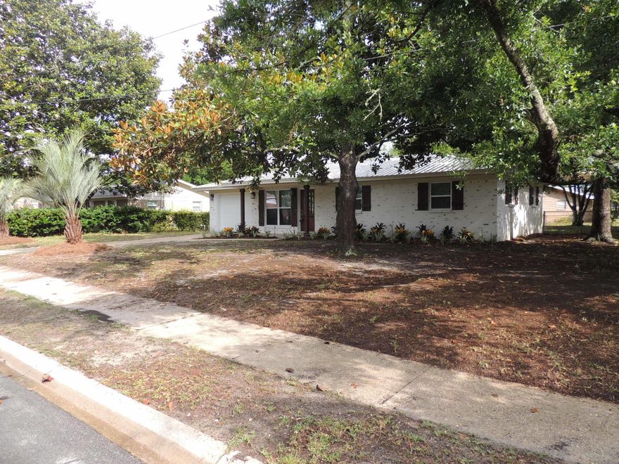 Beautiful updated home with all the modern touches on this big corner lot.Fresh paint gives that new home feel. The kitchen has new white shaker cabinets, granite countertops, an island and stainless steel appliances. The baths have all new fixtures, granite vanity tops, and tiled tub and showers. There are all new light and plumbing fixtures throughout. New contemporary wood look tile in the living areas along with new carpet in the bedrooms makes this home so warm and inviting. The exterior has new garage door and german smear finish brick.Great location near shopping areas, easy commute to Hurlburt AFB or Eglin AFB. Buyer to verify all pertinent information including sq. ft. and lot dimensions.