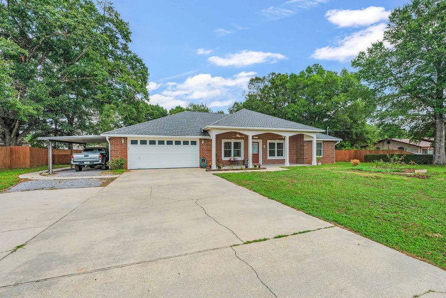 CURB APPEAL with this ALL brick home located on a level 1/2+ acre of land. 2018 RENOVATED kitchen, large country porch, screened porch, WORKSHOP, Outdoor Fire Pit and more! Step into the Living Room and you have a clear view to the back yard. Vaulted ceiling in the Kitchen and tray ceiling in the Dining and Master Bedroom. Plus a double Pantry to add to the expansive cabinets along w/all of the Kitchen appliances to include: GAS Range and Quartz countertops. View of the Fenced back yard from the Kitchen Sink and an oversized Laundry Room has a laundry sink and room for 2 chest type freezers. 2017 Roof, 2013 HVAC Gray shed conveys AS/IS