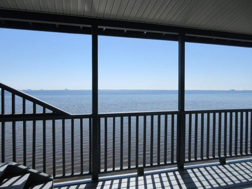 Beautiful custom built home right on Choctawhatchee Bay! Property has been well-maintained with several recent upgrades. New metal roof 2015. Interior and exterior freshly painted. New flooring being installed. Property has phenomenal views from most of the rooms and from the large covered deck. The lower level offers a workshop and garage with extensive storage space. The 2nd level of the home has kitchen, laundry room, 2 bedrooms and baths (master bath has a whirlpool tub), large family room and a great kitchen. Lots of closets and storage space. There is a spiral staircase that leads to a large room with its own air conditioner. Property has installed hurricane shutters and a newer sprinkler system. DON'T WAIT...YOU'LL BE TOOO LATE!!!
