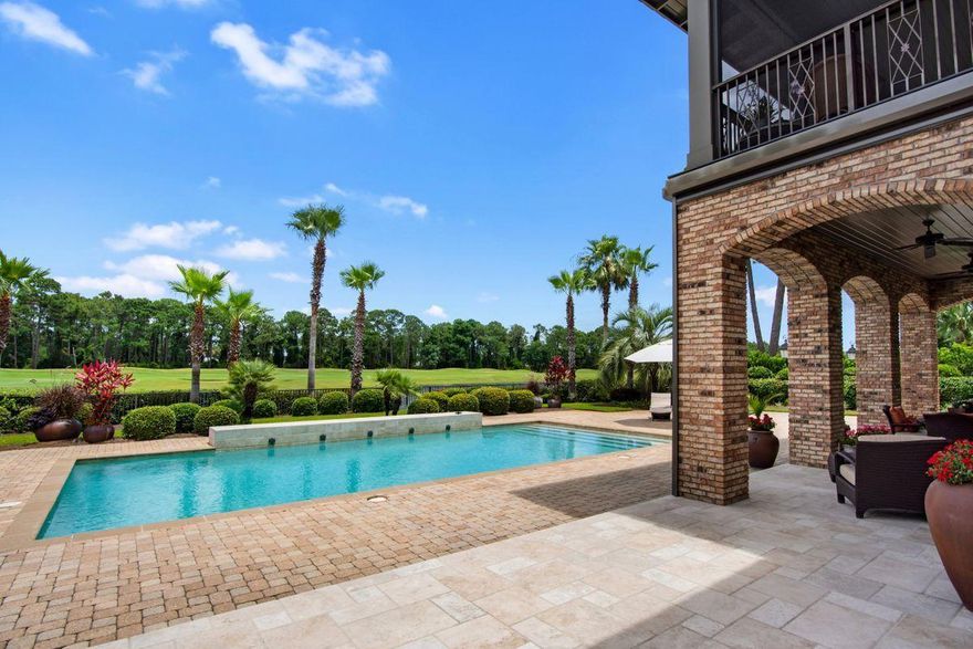 Designed by renowned architect Tom Christ and nestled within the gates of the Sandestin Golf and Beach Resort, this Burnt Pine estate is situated on over half an acre and offers lakefront and fairway views. This home features 5,716 sq. ft of living space and elegant finishes including custom lighting, limestone and hardwood floors, custom cabinetry, and a dramatic fireplace focal point. This is a bright and spacious home with high ceilings and an abundance of natural light. A great place for entertaining, this home offers surround sound, a wine chiller, multiple indoor and outdoor dining areas, and a gourmet kitchen with high-end appliances. Enjoy lake views from a large, covered back patio, or cool off in a private saltwater pool. The first floor also includes a master wing, as well as