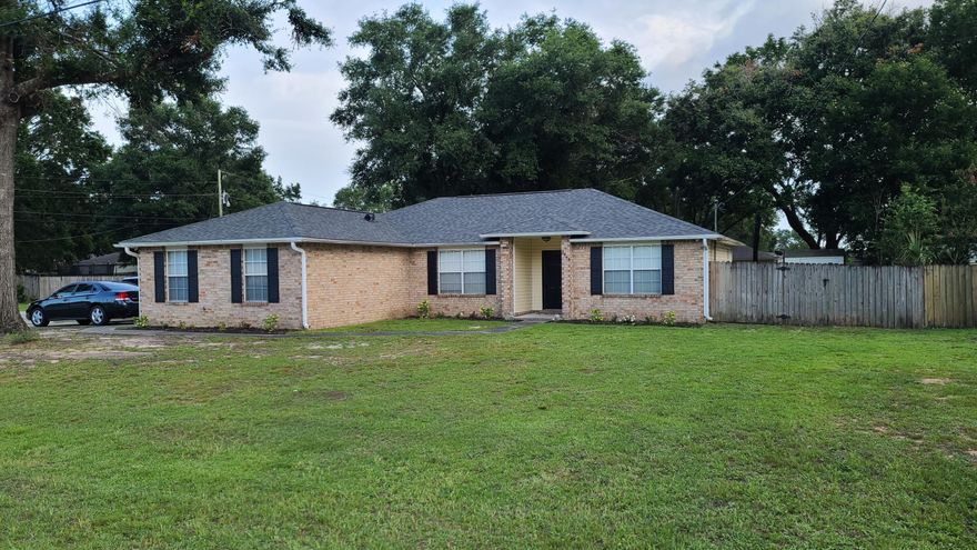 Well kept brick and vinyl home in Crosswinds. Located near Hwy 90 and I-10. The home has a split bedroom floor plan with  3 bedrooms and 2 full baths along with a separate room that can be used as an office or what ever you like. Laundry room off the garage. The home features tile throughout the main living areas and has new vinyl plank in the bedrooms. The backyard is large and has a patio area and 2 yard buildings. New roof May 2021. 2nd Bath has new toilet and vanity. Privacy fence, hot water heater  and toilets were installed recently. All kitchen appliances are included as well as security camera system. Washer and dryer are not included. All square footage is taken from county records and buyer should do due diligence. Listing agent is related to seller.