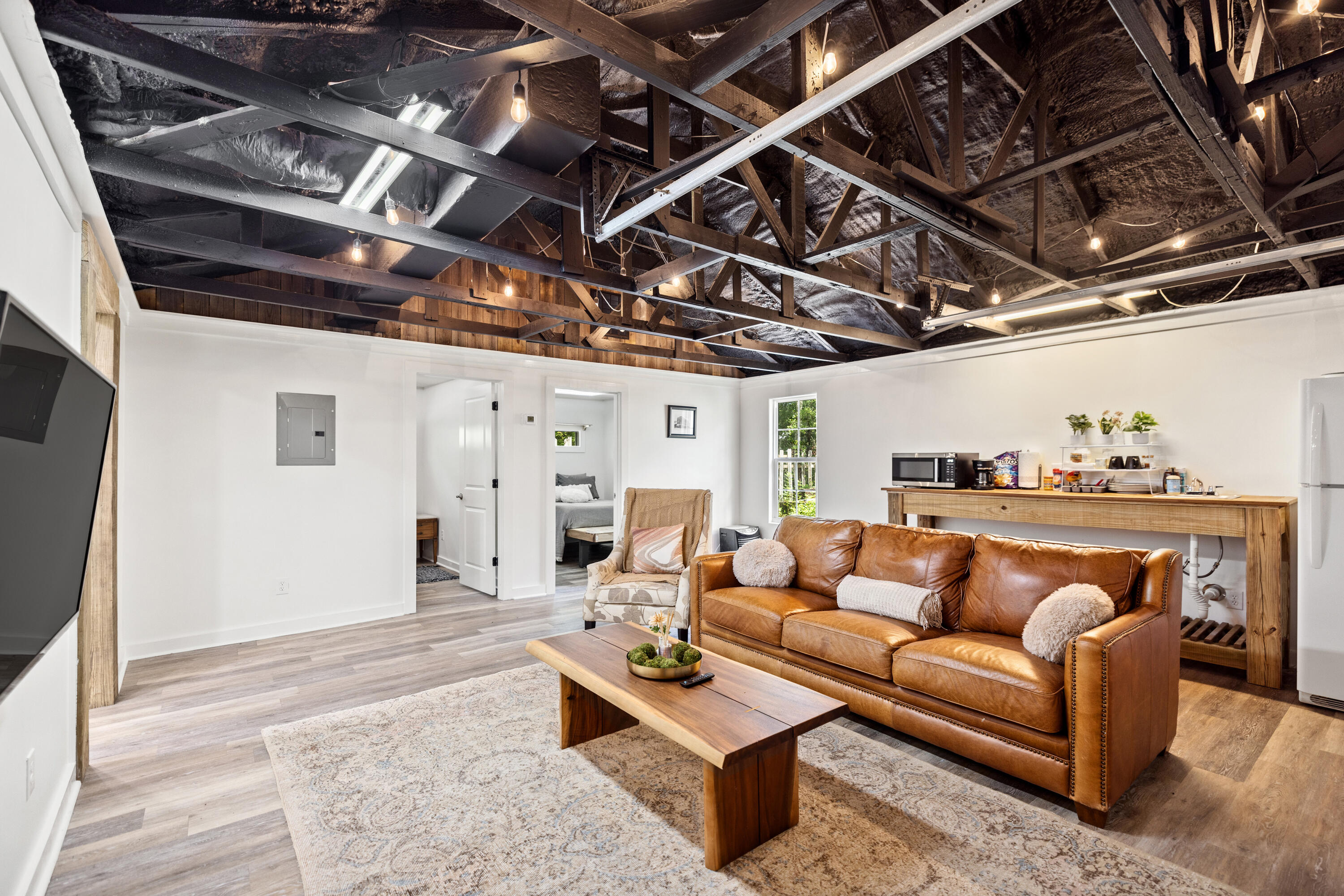 This charming converted garage is the perfect blend of comfort and functionality on this half-acre property! Nestled within a fully fenced yard, this unique offering features a two rooms currently used as bedrooms, a living space with kitchen area. This thoughtfully designed space includes a bright and airy living area, a functional kitchenette with full size fridge, sink and microwave plus two rooms/1 bath for relaxation plus washer/dryer connections in the foyer.But that's not all--craftsmen, hobbyists, and entrepreneurs will love the impressive 36x40 workshop! Whether you're looking to create a studio, store equipment, or work on projects, this versatile space has endless potential.Buyer to verify all details. Call your favorite Realtor for a private tour today.