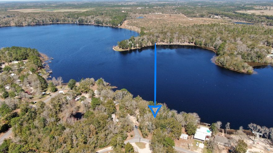 Beautiful, partially cleared Lake Juniper waterfront lot. Fantastic fishing with bass and bream. Mature trees remain after recent clearing with only a slight slope towards the water. Survey is currently underway and will be available to the buyer. Manufactured homes allowed - and could be a beautiful and affordable spot for a getaway or permanent residence.