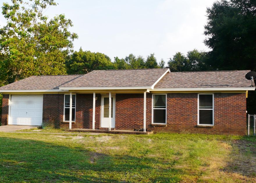 Come see NEW ROOF(2014) and NEW WINDOWS (2014) and NEW PAINT (2015)and NEW TILE FLOORS THROUGHOUT(2015)your home?? Lot is 100x200 AND LEVEL fenced backyard lot with gates for those Big Toys to go in and out. Riding lawnmower included. Yes, it works! All of that comes with this 3 bedroom home with a garage and AC only 5 yrs old. Even the refrigerator is included (along with the like new smooth top stove and a dishwasher). There is even a separate fenced area for a garden or pets. Huge Eat-In Kitchen -20x14 with plenty room for Dining Set! Seller says electric approx. $100 mo with thermostat set at 72 degrees. It is pristine clean and has been loved and cared for it! Location-1 blk to elementary school, middle school bus stop in front, 2 mi to airport, easy to jobs, bases and BEACHES!!