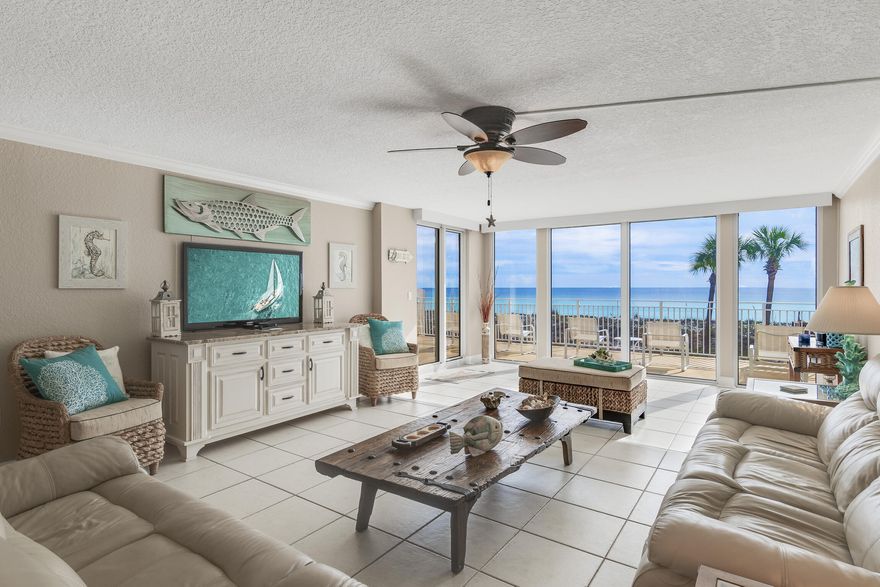 Enjoy stunning beachfront views from virtually every room in this spacious 2 br condo. This residential and rental restricted gem comes with storage and covered garage parking. The unique layout features two gulf front bedrooms, extended living area, tile floors, large master suite, stainless steel appliances, quartz countertops, new A/C unit, and electric retractible sun shades. The master bath has a large shower, quartz countertops and plenty of closet space/storage. The guest bathroom has been remodeled with subway tile and marble floors. With over 240 ft of beachfront, this low density complex has one of the least crowded beaches along the Emerald Coast. This 24 unit building is located on Holiday Isle with amenities that include: swimming pool, tennis court and security gate.
