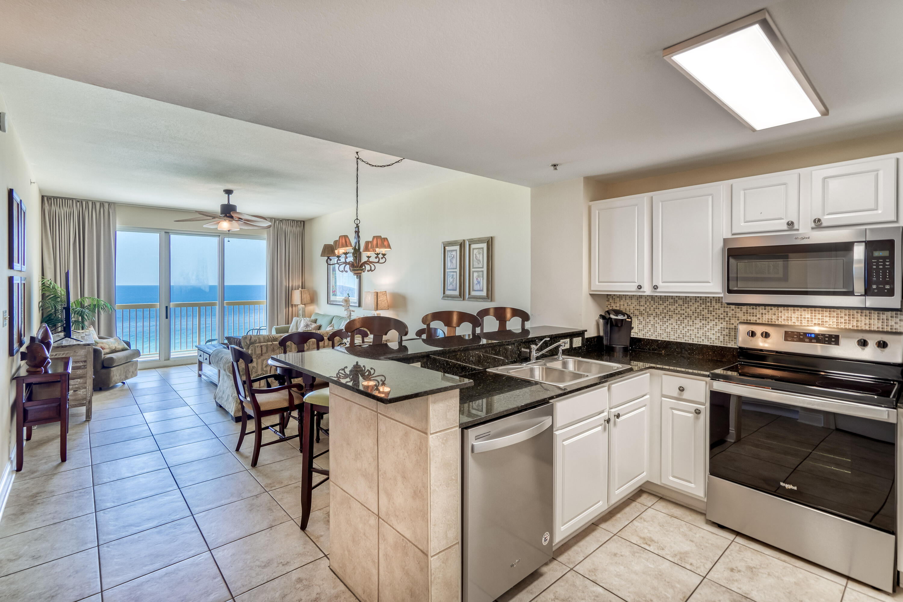 Calypso Beach Resort is the most well known beach front development in a Panama City Beach with a perfect location adjacent to the Pier Park Shopping District. Calypso 1609 is a true corner condo that boasts many upgrades including a remodeled bathroom, tile throughout, stainless appliances, two toned painted cabinets (light grey on the bottom and white up top), backsplash, updated fans and lighting, new plantation shutters and window treatments, full laundry room, wraparound corner balcony and additional side windows with the corner orientation. Condos like this are rarely available with such minimal wear and tear. The master bedroom offers balcony access and a large en-suite bath that boasts a stand alone shower, separate tub, upgraded lighting and large walk-in closet. This condo is a