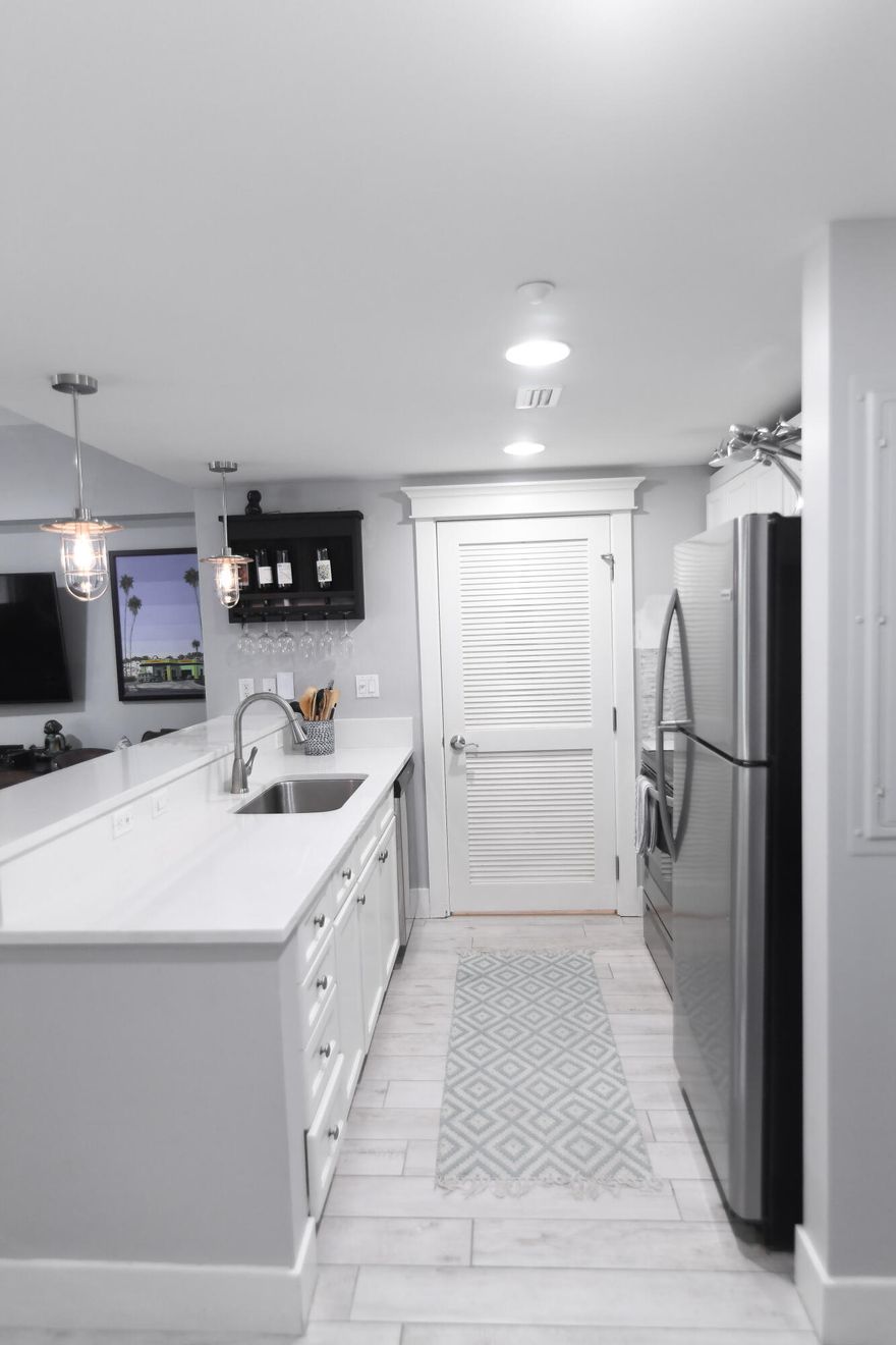 Beautifully updated ground-floor condo centrally located in Sandestin Golf & Beach Resort's Grand Complex. Polished and sophisticated, this unit was completely updated in 2019 with new countertops, lighting, appliances, flooring, window treatments, and paint to name just a few. You will love the sleek finishes throughout. With an open floor plan and separate full bathroom for guests, this condo was designed for entertaining. Light pours in through floor-to-ceiling windows in the main living space creating a bright and airy feel. Restore and relax on the covered patio overlooking the lush landscape and take advantage of not only the tranquil setting, but also being located a short distance from all the shopping, restaurants, and entertainment that the Village of Baytowne Wharf has to offer.