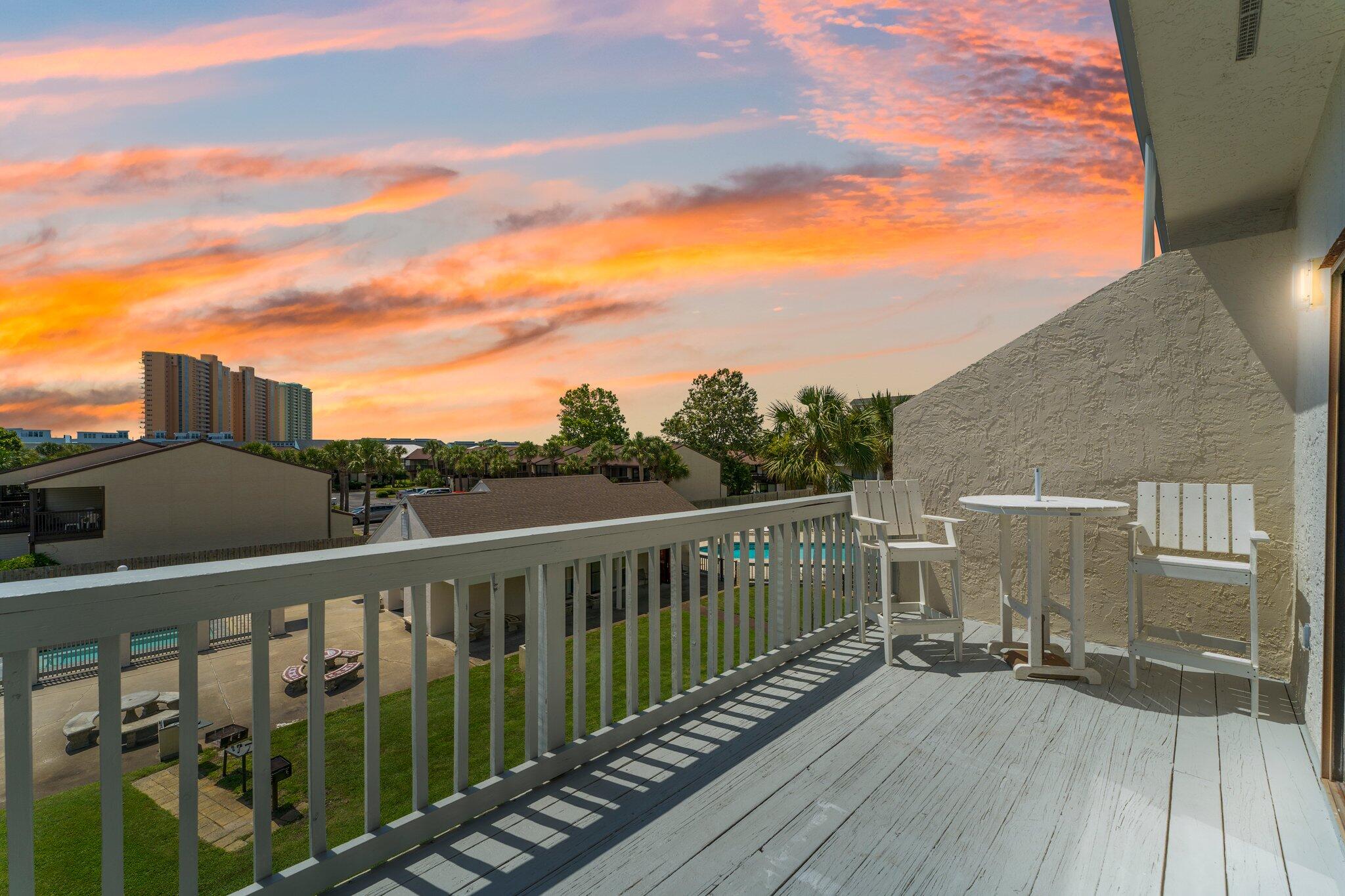 Welcome to 17614 Front Beach Rd Unit D15, a beautiful 2-bedroom, 2-bathroom condo in the peaceful Endless Summer complex on Panama City Beach's West End. This 758 sf condo, built in 1986, offers a blend of comfort and style. The open living area features hardwood-like floors and sliding glass doors that lead to a private balcony that overlooks the two community pools and grills. The kitchen boasts granite countertops, a glass tile backsplash, a built-in wine rack, and stainless-steel appliances including a flat top stove.Endless Summer is a family-friendly, low-rise condo complex just across the street from the Gulf of Mexico. Enjoy the convenience of two public beach access points, and the proximity to shopping and dining options, including Pier Park.