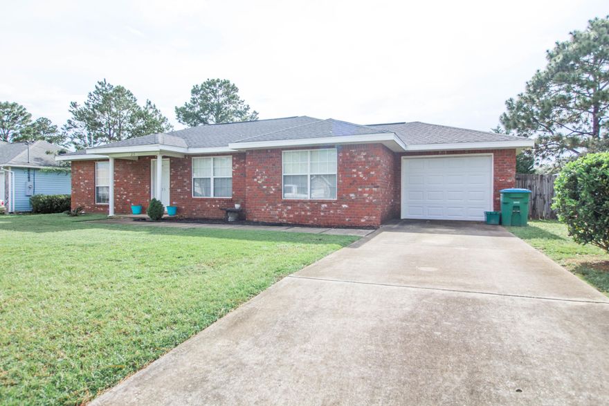 Well maintained 3 bedroom 2 bath home located in south Crestview for quick and easy access to the local bases, beaches, and shopping centers. Less than 10 minutes from the local grocery stores. Split floor plan allows for privacy yet the size of living room and dining area is great for entertaining and keeping an eye on the kids. Kitchen boasts ample cabinet and counter top space. The whole home is tiled for easy maintenance and clean up. Large spacious fenced in back yard is great for the kids and family dog to play in. There is a yard building for extra storage. Schedule your showing today!!!