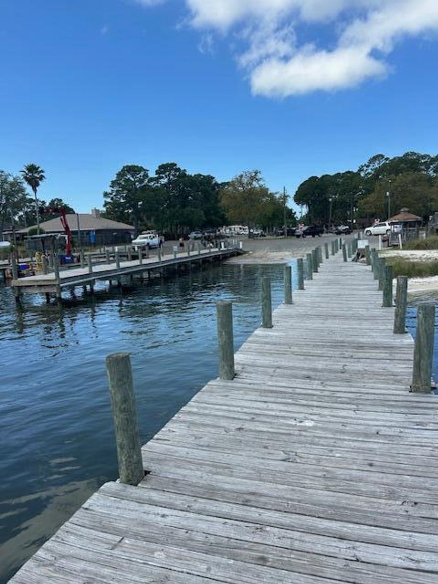 Located only 3 blocks away from Joe's Bayou Boat Launch, so bring your boat! Nestled in the oaks and on a corner lot in the heart of Destin Florida. There is so much privacy and shade to enjoy with the surrounding oak trees. The entire property speaks of New Orleans, with a red brick back patio, to the wrap around screened porches. But it's ready for someone that loves to get on the emerald waters to enjoy boating, fishing, skiing or sunset cruises! There's an oversized driveway and detached two car garage for your equipment and all your beach toys. Located in a X Zone, so flood insurance is not required. Take a short walk down the sidewalk to the boat launch or to the waterfront City Park and Pier. Joe's Bayou Boat Launch is free for residents too!