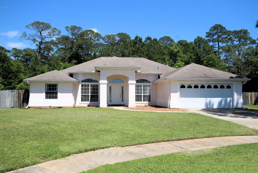 Elegant, move-in ready home with 4 bedrooms, 3 full baths and 2260 sq ft located only minutes from the bases, beaches, shopping, and restaurants! The home has a beautiful gunite pool (18x36) with a screened enclosure and a gas hookup for grilling! Enter the foyer and notice the 11' ceilings in the foyer, dining room, living room, and home office! The foyer opens on the left through French Doors to a home office and also to the dining room on the right. All the interior walls have been professionally painted (2017). The living room features a gas fireplace and opens to the kitchen and eat-in area! The kitchen has a large bay window that overlooks the pool and expansive backyard! There is also a side-by-side refrigerator, built-in microwave, dishwasher and a new GE Range/oven (2017).  The raised breakfast bar seats three comfortably. The home features a split floor plan! The master bedroom features trayed ceilings and French Doors to the enclosed pool and patio. The 5-piece, ensuite master bathroom has double vanities with a cultured marble top, spa tub, walk-in shower, separate linen closet, and water closet with a pocket door. In addition there is a large walk-in closet with shelving. Enjoy your morning cup of coffee while relaxing outside your master bedroom near the pool! On the other side of the home there are three bedrooms and two full bathrooms! One of the bedrooms is separated from the other two for additional privacy and has a door nearby to access the covered, enclosed pool and patio. The home features a two car-garage with automatic garage door opener, a large laundry room with wash basin and additional refrigerator, gutter systems on the exterior, and a privacy fence with gates enclosing the entire backyard and a sprinkler system. The backyard is expansive and the privacy fence backs up to a wooded area which provides a beautiful view, plenty of birds, and maximum privacy. The pool deck has been professional painted (2017) and the exterior of the home was professionally power washed (2017). The homeowner installed a new HVAC system with permanent filters (2011-2012). The home sits on a beautiful 0.42 acre lot. Home warranty is being offered with acceptable offer. Buyer to verify all dimensions and information. Home has termite bond, good through April 2018.