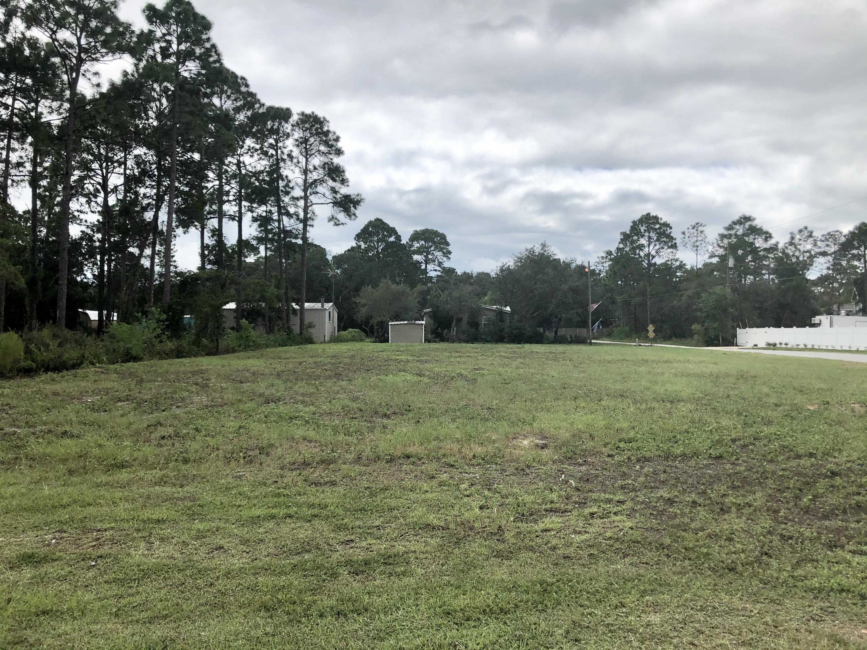 Have you dreamed of being within walking distance to the bay? Don't miss this opportunity to own a beautiful corner lot measuring approximately .34 acres with No HOA. Given the 75' x 200' lot size you will have ample room for house, garage or guest residence and a pool. Blue Bayou is just 2 streets south of the Chocotawhatchee Bay and about 10 minutes from the beach. Conveniently located near the shops, restaurants and entertainment of Grand Boulevard as well as the services provided at Ascension Sacred Heart Hospital. Cleared and utilities available this would be a great location for your next home. Dimensions should be verified by buyer if important