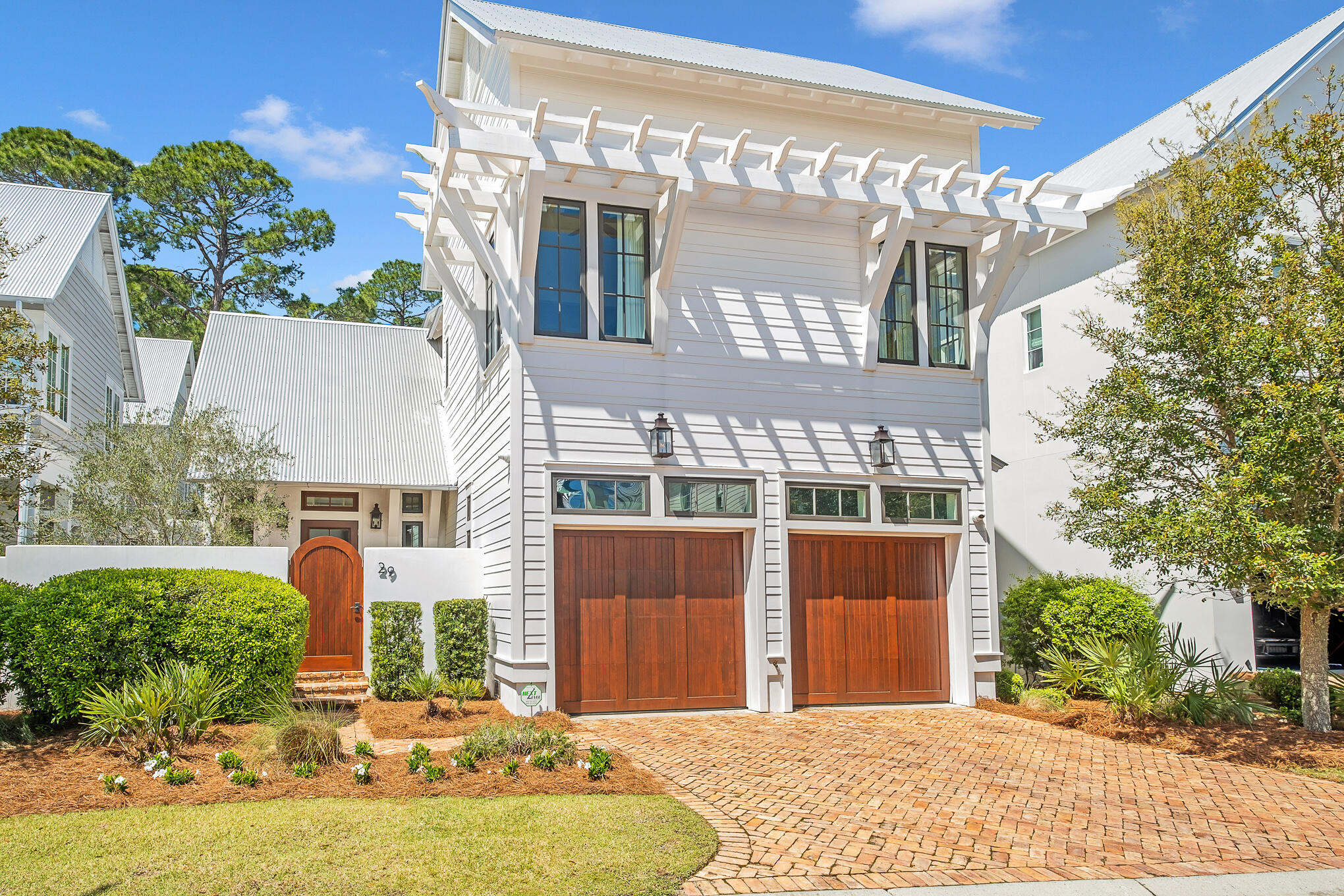 Tucked away in Churchill Oaks, this exquisitely designed Geoff Chick Coastal Home has 4 Bedrooms and 4.5 Baths.  High end finishes throughout the house including New White Oak Hardwood  Flooring and Coffered Ceilings.  The Architectural Details blend functionality and understated elegance. Decorated by Summer House. The Furniture and Artwork are Negotiable. This Custom Home features Master Suites on the First and Second Floors and an Open Living Area on both levels.