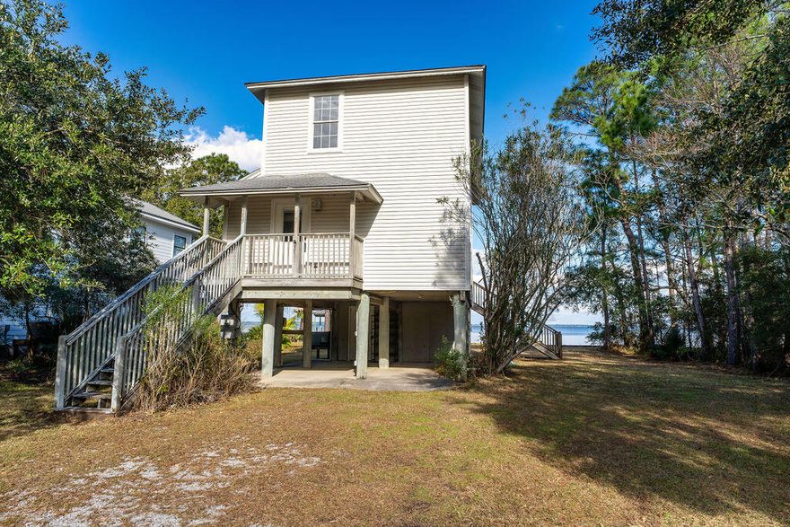Amazing view of the Bay await, from the Auction REO Florida Cottage styled home. This home has 2 bedroom and 2 baths. Beds and baths are located on the 2nd floor. Kitchen and the living room both have beautiful view of the Bay. To help visualize this home's floorplan and to highlight its potential, virtual furnishings may have been added to photos found in this listing.