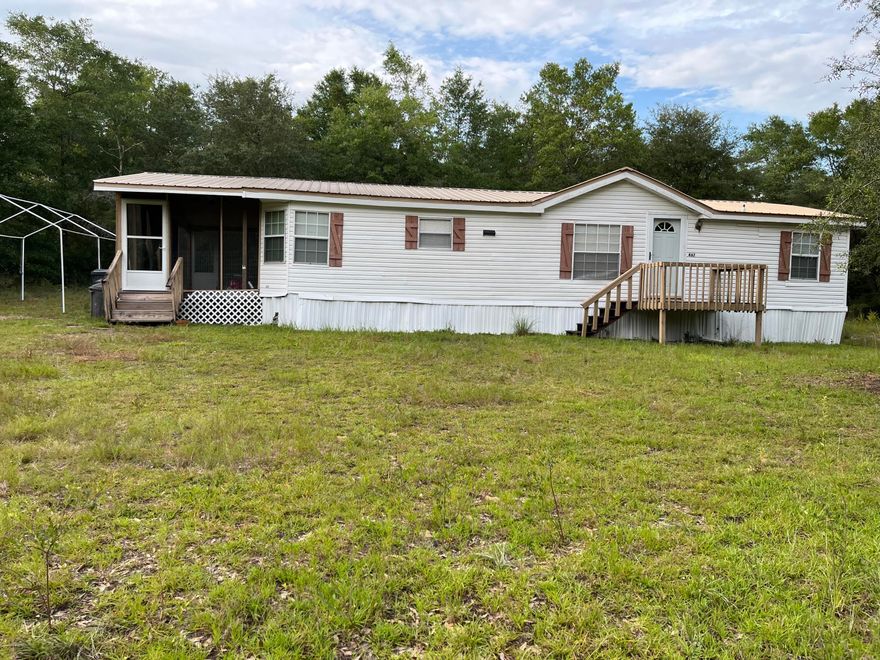 Discover your peaceful haven in DeFuniak Springs, Florida. This charming 3-bedroom, 2-bathroom mobile home is nestled on 1 acre of land, just minutes from Juniper Lake and the beautiful beaches offering the perfect balance of comfort, space, and convenience. Whether you're relaxing in the living room or entertaining guests, the home provides a warm and inviting atmosphere ideal for both everyday living and entertaining. The property offers a sense of seclusion while remaining conveniently located. Whether seeking a full-time residence or a peaceful getaway, this home is a great find in an ideal location. Would like to mention the metal roof is 6 years old and the Ac still has 4 years of the warranty left! Schedule your showing today!